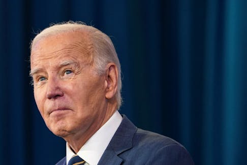 U.S. President Joe Biden looks up while addressing the White House Tribal Nations Summit at the Department of the Interior in Washington, U.S., December 6, 2023.