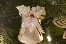 Karen Ubsdell's glass bell was purchased in 1962 in Germany. Seeing it on the tree like this was one of her father's great joys. - Contributed