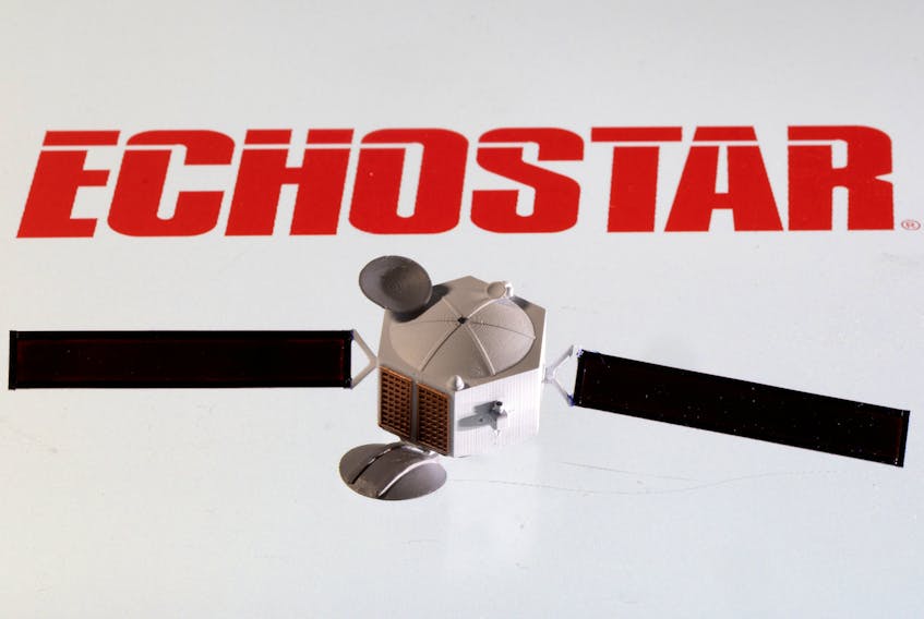 A satellite model is placed on EchoStar Satellite Services logo in this picture illustration taken April 4, 2022.