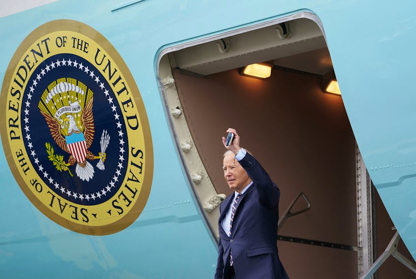 U.S. President Joe Biden waves as he steps from Air Force One upon his arrival in Boston, Massachusetts, U.S., December 5, 2023.