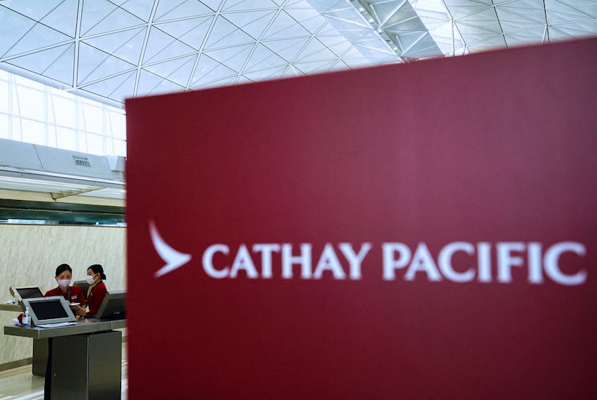 Cathay Pacific employees work at Hong Kong International Airport, in Hong Kong, China March 8, 2023.