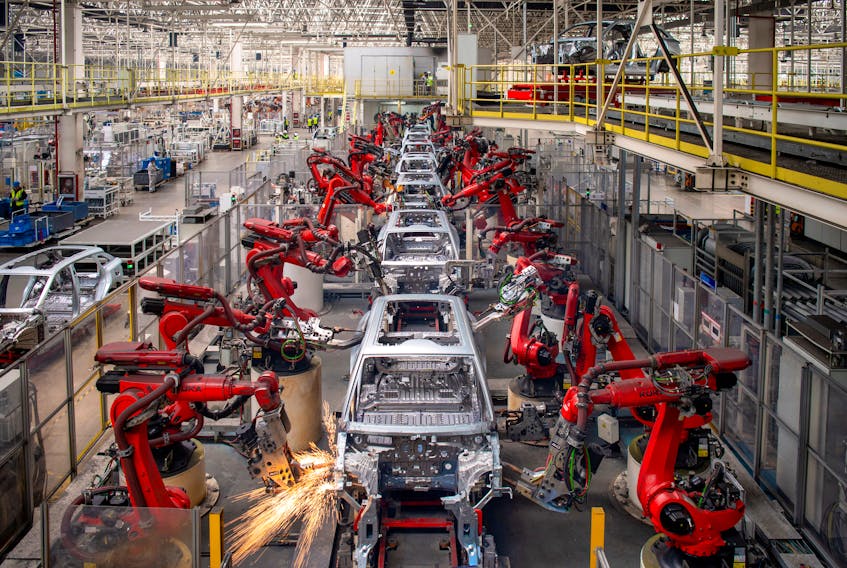 Robotic arms assemble cars in the production line for Leapmotor's electric vehicles at a factory in Jinhua, Zhejiang province, China, April 26, 2023. China Daily via
