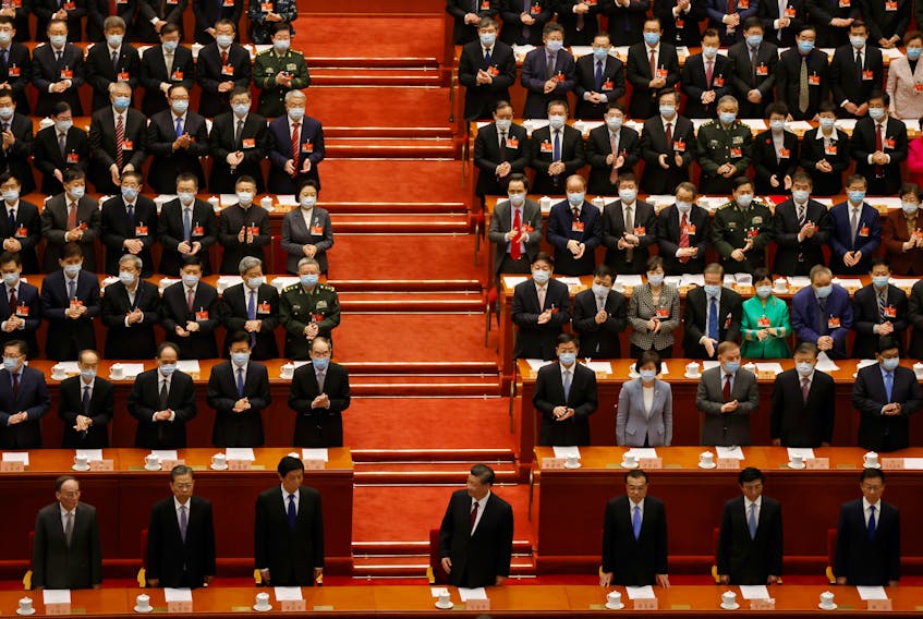 Chinese President Xi Jinping (C), Vice President Wang Qishan, Politburo Standing Committee member Zhao Leji, National People's Congress (NPC) Standing Committee Chairman Li Zhanshu, Premier Li Keqiang, Politburo Standing Committee member Wang Huning and Vice Premier Han Zheng arrive for the closing session of the Chinese People's Political Consultative Conference (CPPCC) at the Great Hall of the People in Beijing, China March 10, 2021.