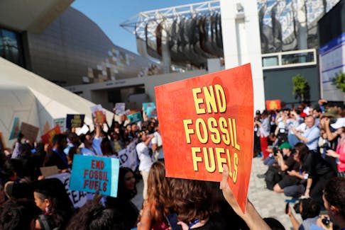 Climate activists protest against fossil fuels at Dubai's Expo City during the United Nations Climate Change Conference COP28 in Dubai, United Arab Emirates, December 8, 2023.