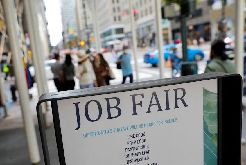 Signage for a job fair is seen on 5th Avenue after the release of the jobs report in Manhattan, New York City, U.S., September 3, 2021.