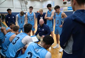 Mount Saint Vincent Mystics head coach Danny DePalma, centre, talks to his team during a recent ACAA basketball game this season. The Mystics enter the holidays as the No.1 in the CCAA. - Dave Gallant