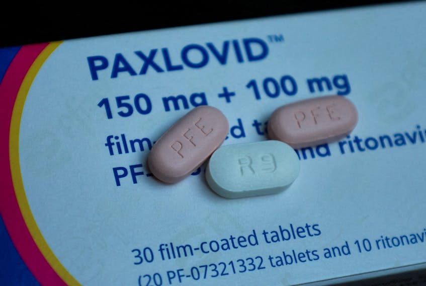 Paxlovid, Pfizer's anti-viral medication to treat the coronavirus disease (COVID-19), is displayed in this picture illustration taken October 7, 2022. A morning and an evening does consists of one white 100-milligram tablet of Ritonavir and two pink 150-milligram tablets of PF-07321332. REUTERS/Wolfgang Rattay/Illustration  Half of the participants in CanTreatCOVID, a national research project aimed at finding effective, safe and affordable medications to treat COVID-19, will be given Paxlovid, a medication used to treat symptoms and possibly prevent long-term effects of being infected with the virus. - REUTERS/Wolfgang Rattay/Illustration