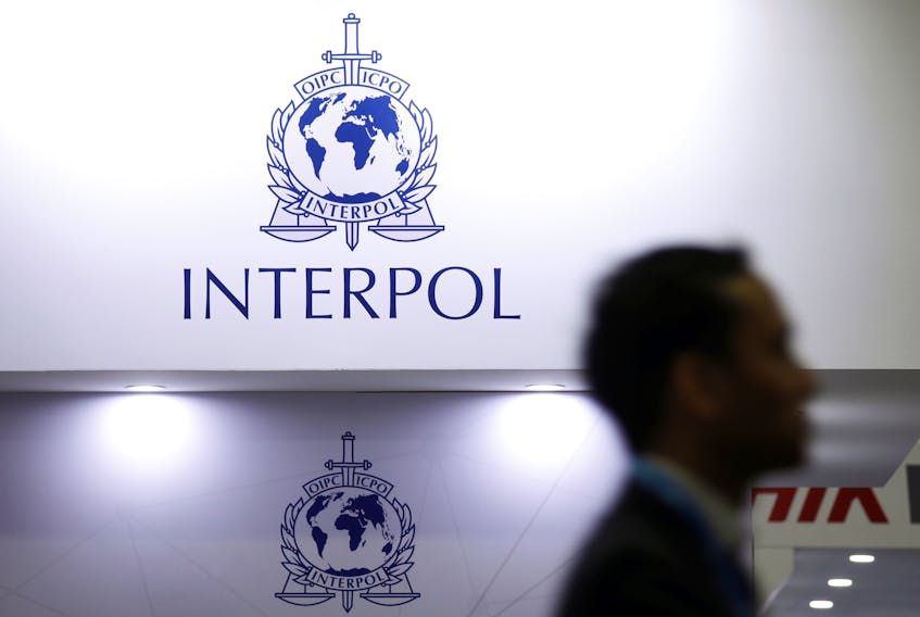 A man passes Interpol signages at Interpol World in Singapore July 2, 2019. 