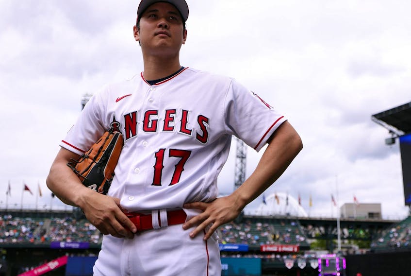Shohei Ohtani of the Los Angeles Angels looks on during Gatorade All-Star Workout Day at T-Mobile Park.