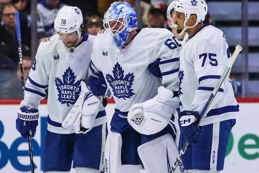 TJ Brodie and Ryan Reaves of the Toronto Maple Leafs assist goaltender Joseph Woll off the ice after an injury against the Ottawa Senators at Canadian Tire Centre on December 7, 2023 in Ottawa.