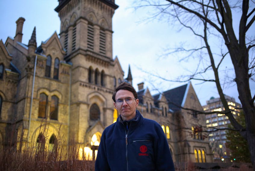 Justinas Stankus, 38, who came to Canada from Lithuania in 2019 and is studying at the University of Toronto, poses on the campus in Toronto, Ontario, Canada, November 29, 2023. 