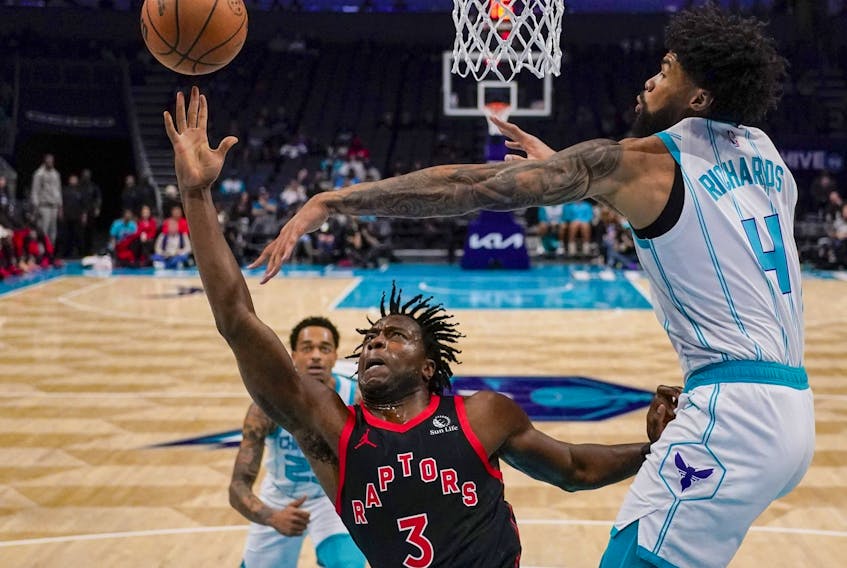 Charlotte Hornets center Nick Richards blocks a shot by Toronto Raptors forward O.G. Anunoby during the first half of an NBA basketball game Friday, Dec. 8, 2023, in Charlotte, N.C.