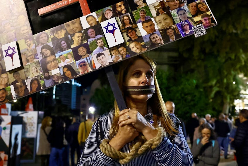 People attend a rally calling for the release of hostages kidnapped on the deadly October 7 attack by Palestinian Islamist group Hamas, amid the ongoing conflict between Israel and the Palestinian Islamist group Hamas, in Tel Aviv, Israel, December 9, 2023.