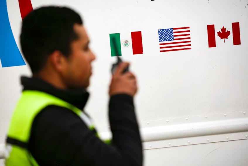 Flags of Mexico, United States and Canada are pictured at a security booth at Zaragoza-Ysleta border crossing bridge, in Ciudad Juarez, Mexico January 16, 2020.