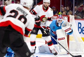 Canadiens goaltender Jake Allen keeps his eye on the play as Senators' Derick Brassard parks in front of the net while veteran Claude Giroux looks on. at the Bell Centre Tuesday night.