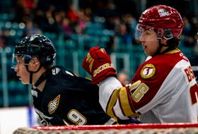 Ivan Ivan of the Cape Breton Eagles, left, battles in front of the net with William Bishop of the Acadie-Bathurst Titan during Quebec Major Junior Hockey League action at the K.C. Irving Regional Centre in Bathurst, N.B., on Tuesday. Cape Breton won the game 2-1. PHOTO/Bryannah James, Acadie-Bathurst Titan.
