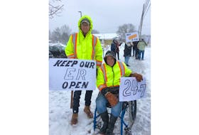 Ed Reid, left, and Lester Bartson attended a rally in support of a 24-hour, seven-day a week emergency department at Soldiers Memorial Hospital in Middleton on Jan. 31.