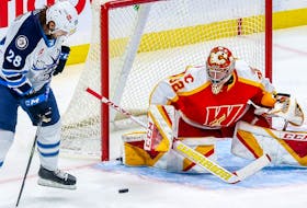 Calgary Flames puck-stopping prospect Dustin Wolf now leads the American Hockey League in wins, with 25.