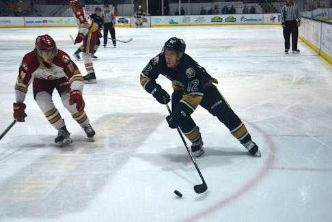 Charlottetown Islanders forward and captain Keiran Gallant, 12, looks to go wide on the Acadie-Bathurst Titan’s Noah Ryan, 11, during a Quebec Major Junior Hockey League (QMJHL) game at Eastlink Centre earlier this season. The Islanders host the Halifax Mooseheads in back-to-back games on Feb. 2 and 3 at Eastlink Centre.