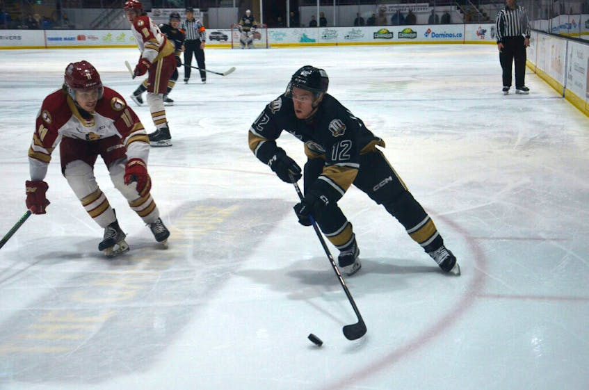 Charlottetown Islanders forward and captain Keiran Gallant, 12, looks to go wide on the Acadie-Bathurst Titan’s Noah Ryan, 11, during a Quebec Major Junior Hockey League (QMJHL) game at Eastlink Centre earlier this season. The Islanders host the Halifax Mooseheads in back-to-back games on Feb. 2 and 3 at Eastlink Centre.