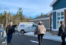Project manager of the new Municipality of Shelburne administrative center project, Andrew Amos (left) directs some delivery people. The building, being constructed by Rikjak Construction, Lunenburg is nearing completion. KATHY JOHNSON