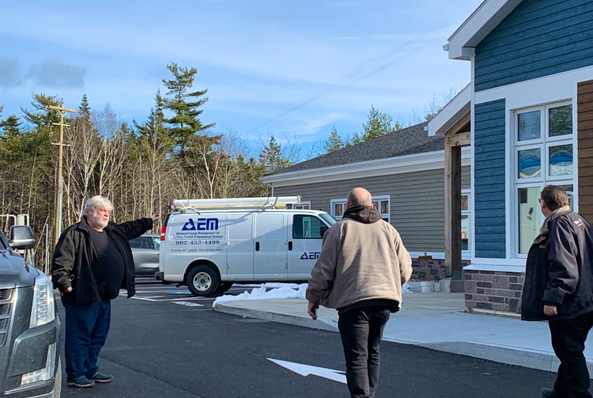 Project manager of the new Municipality of Shelburne administrative center project, Andrew Amos (left) directs some delivery people. The building, being constructed by Rikjak Construction, Lunenburg is nearing completion. KATHY JOHNSON