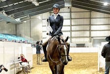 Kaidyn Goodwin rides her quarter horse Parker out of the ring with prize medal and ribbon in hand. Goodwin is one of two teens from Yarmouth County named to Team Canada for the 2023 American Quarter Horse Youth World Cup. CONTRIBUTED