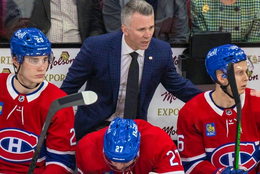 Montreal Canadiens head coach Martin St. Louis behind the bench during game against the Nashville Predators in Montreal on Jan. 12, 2023.
