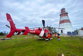 Canadian Coast Guard technicians arrive by helicopter on Seal Island in May, 2022, to fix the foghorn in the Seal Island lighthouse. Built in 1831, the Seal Island Lighthouse is located on Seal Island off of southwestern Nova Scotia and is still operational. It is North America’s second oldest wooden lighthouse. With the exterior of the structure falling into a state of disrepair, many who frequently visit the island wonder if it will be standing much longer. CHRIS MILLS