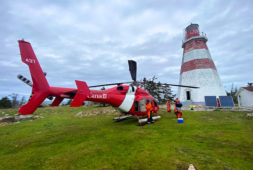 Canadian Coast Guard technicians arrive by helicopter on Seal Island in May, 2022, to fix the foghorn in the Seal Island lighthouse. Built in 1831, the Seal Island Lighthouse is located on Seal Island off of southwestern Nova Scotia and is still operational. It is North America’s second oldest wooden lighthouse. With the exterior of the structure falling into a state of disrepair, many who frequently visit the island wonder if it will be standing much longer. CHRIS MILLS