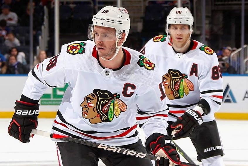 Jonathan Toews and Patrick Kane of the Chicago Blackhawks skates against the New York Islanders during the second period at the UBS Arena on December 04, 2022 in Elmont, New York.