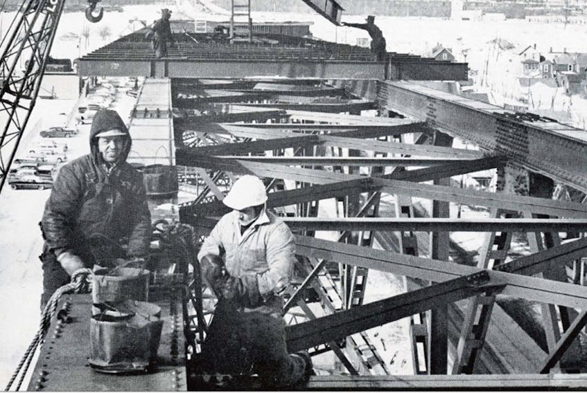 Isaac Phills (left) at work at the Sydney steel plant in the early 1960s.