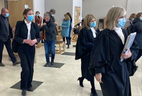 The lawyers involved in William Michael Sandeson's first-degree murder trial leave court for a break during final arguments Wednesday. From left are defence lawyer Alison Craig and Crown attorneys Carla Ball and Kim McOnie.