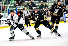 Eagles' Antoine Roy, centre, and Angelo Fullerton, right, fend of Armada's Thomas Paquet during QMJHL action Saturday night in Boisbriand, Que. CONTRIBUTED/SÉBASTIEN GERVAIS