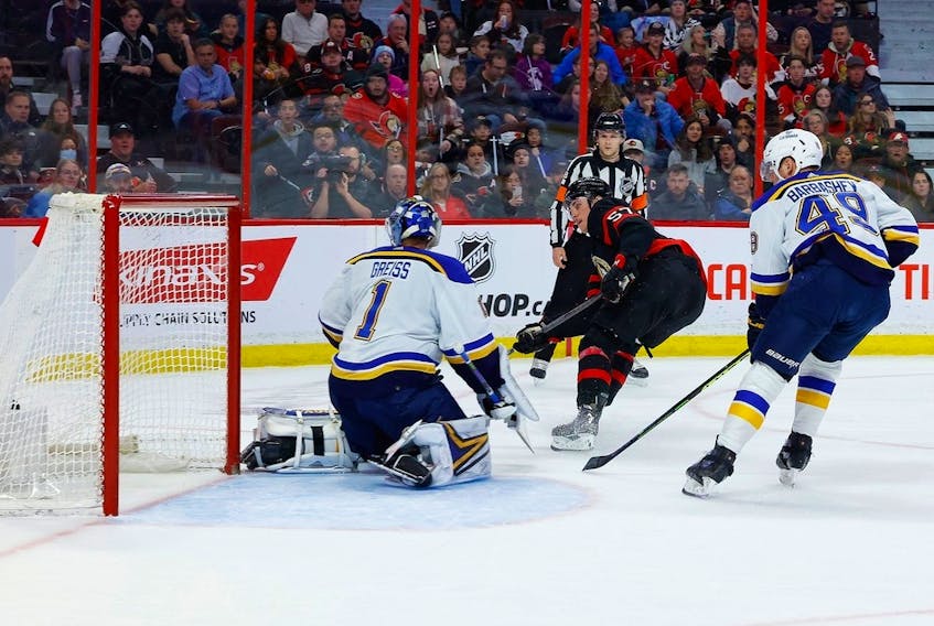 Ottawa Senators centre Shane Pinto (57) scores on St. Louis Blues goaltender Thomas Greiss (1) during first period NHL action at the Canadian Tire Centre on Sunday, Feb. 19, 2023.