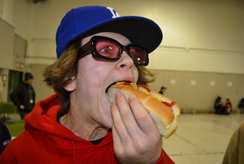 “It deliverered,” Reid Mayich, a Grade 8 student at Breton Education Centre said after trying the legendary Coal Bowl Classic hot dog. GREG MCNEIL/CAPE BRETON POST