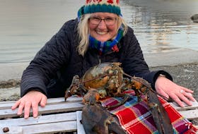 This year’s Nova Scotia Lobster Crawl Lob-Star Heather Jeffers poses with Lucy the Lobster at the crustacean’s fifth annual Groundhog Day prediction on Feb. 2 at the North East Pont Beach on Cape Sable Island next to the Cape Sable Island Causeway. KATHY JOHNSON