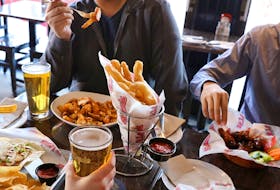 Customers dine at St. Louis Bar and Grill in this promotional photo. Contributed