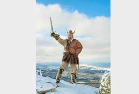 Leif the Lucky, the Corner Brook Winter Carnival mascot, stands triumphant atop Marble Mountain. Leif, who emerges from his hut of ice and snow each year to kick off festivities, embodies the spirit of winter carnival. CONTRIBUTED