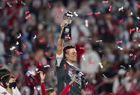 Tampa Bay Buccaneers quarterback Tom Brady holds up the Vince Lombardi trophy after defeating the Kansas City Chiefs in the NFL Super Bowl 55 football game, Feb. 7, 2021, in Tampa, Fla. 