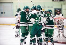 Teammates embrace Chiara Esposito, who scored two goals with an assist in UPEI's Game 3 win over Dalhousie on Feb. 19. Contributed