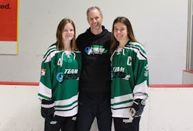 The Caron family from Summerside is taking part in the Canada Games on home soil this week. Andrea, left, and Natalie are playing ringette for their father, head coach Francois. Contributed