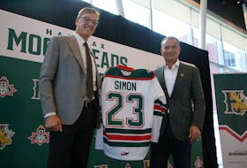 Bobby Smith, presents a Halifax Mooseheads jersey to new owner U.S. businessman Sam Simon during a news conference at the Nova Centre in Halifax on Tuesday February 21, 2023.


TIM KROCHAK PHOTO