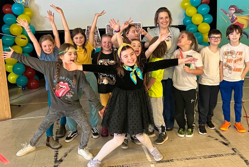 Abigale Latoszek (front, centre) was named the Janeway and Children’s Miracle Network Champion for 2023 on Tuesday, Feb. 21, in front her family, friends, teachers and school staff at St. Mary’s Elementary. Janeway Children's Hospital Foundation Facebook photo