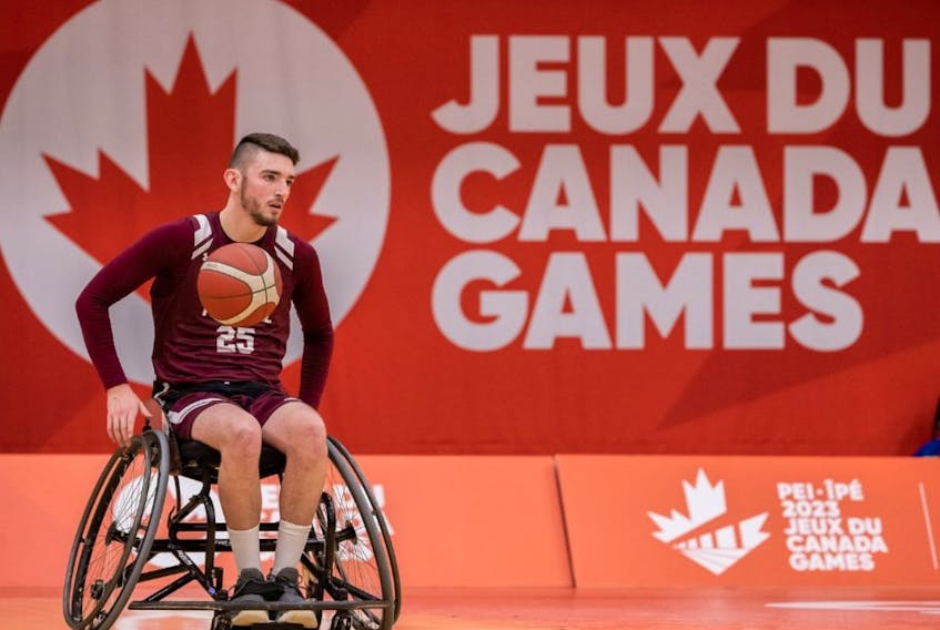 Bay Bulls wheelchair basketball athlete Jack Kennedy controls the ball during play at the 2023 Canada Winter Games being held in Prince Edward Island this week. Team NL headed into action against Saskatchewan on Wednesday 0-2 with losses to New Brunswick and Quebec. Photo courtesy Canada Games/Facebook