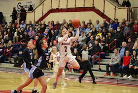 Acadia Axewomen guard Haley McDonald hits the first bucket of the night on Feb. 11, her final home game at Stu Aberdeen Court. McDonald gave the home fans one last star performance to remember her by.  
Jason Malloy