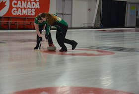 P.E.I. second stone Kacey Gauthier, left, and lead Erika Pater sweep a rock during play in the 2023 Canada Winter Games’ curling competition at the Silver Fox Entertainment Complex in Summerside on Feb. 22. Team P.E.I. won the game 9-3 over the Yukon. Jason Simmonds • The Guardian