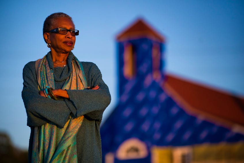 Daurene Lewis poses for portrait in front of the replica Seaview African United Baptist Church on Africville lands in Halifax, Wednesday, Sept. 21, 2011. File