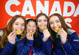 Nova Scotia's female curlers celebrate their gold medal at the Canada Winter Games in Prince Edward Island. - Len Wagg