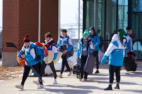 There was plenty of activity at the 2023 Canada Winter Games' athletes village at UPEI in Charlottetown Feb. 26 as competitors from Week 1 prepared to return home, making way for those participating in the second week of events.
Teams from across Canada could be seen packing up and boarding buses in the morning hours of turnaround day, to be shuttled to the Charlottetown Airport. There, over 1,600 athletes, managers and coaches will depart while another 1,500 arrive simultaneously to kick off Week 2 of the games, said a emailed statement from Canada Games host society.
At the athletes village, competitors took time to say goodbye to their teammates, exchanging hugs, high fives and excited waves, while others gathered for group photos.In the statement, the Canada Games host society said both athletes village and the event venues would be turned over for a new set of sports, which kick off on Feb. 27. Cody McEachern • The Guardian